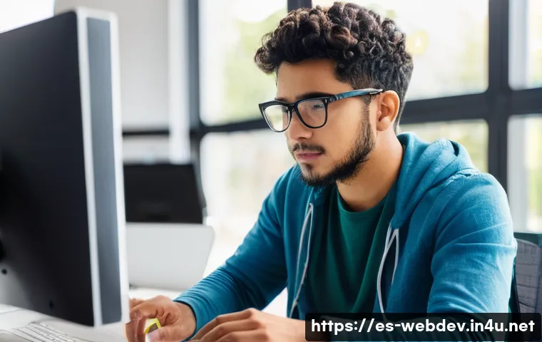 웹개발자 실무 경험 - A modern web developer workspace showing a young Hispanic man in casual attire wearing glasses and f...